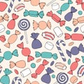 Hand drawn vector candies, canes and marshmallows seamless pattern on the beige background.