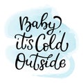 Hand drawn vector lettering Baby it is cold outside. Isolated bl