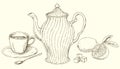 Vintage teapot and cup of tea with lemon.