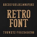 Hand drawn vintage typeface. Retro alphabet font. Type letters and numbers on a rough wooden background. Royalty Free Stock Photo