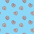 Hand drawn watercolor seamless pattern with tasty pretzel on blue background