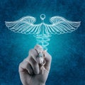 Hand draws Caduceus on white board Royalty Free Stock Photo