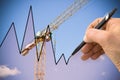 Hand draws a graph with a background of a construction site - concept image