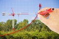 Hand draws a growing chart about building activity against a background with a tower crane in a construction site surrounded by Royalty Free Stock Photo