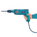 Hand drill in the hands of a worker. Manual electric tool. Drilling tool.