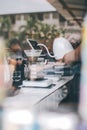 Hand drip coffee, Barista making drip coffee.Barista pouring water over the coffee powder the hot water drips through the filter a Royalty Free Stock Photo