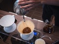 Hand drip coffee Barista pouring water on coffee ground with filter Royalty Free Stock Photo