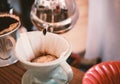 Hand drip coffee, barista pouring water on coffee ground