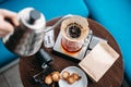 Hand drip coffee, barista pouring water on coffee ground with filter Royalty Free Stock Photo