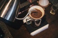 Hand drip coffee Barista pouring water on coffee ground with filter Royalty Free Stock Photo