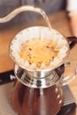 Hand drip coffee, Barista pouring water on coffee ground with filter Royalty Free Stock Photo