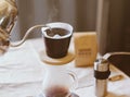 Hand drip coffee, pouring water on coffee ground