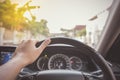 Hand of driver on steering wheel of car Royalty Free Stock Photo