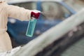 Hand of a Driver Using De-icer Spray for Windshield Royalty Free Stock Photo