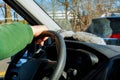 Hand driver on wheel of the car in the car