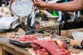 Hand Driving Away Flies Over Minced Meat Next To A Grinder Outdoors In Toliara