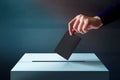 Hand Dropping a Ballot Card into the Vote Box, Polish and Dark T Royalty Free Stock Photo