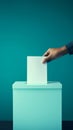Hand dropping a voting slip into a ballot box, teal background Royalty Free Stock Photo