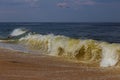 Hand of drowning man trying to swim out of the stormy ocean. Royalty Free Stock Photo