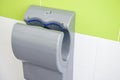 Hand dryer in public WC, closeup Royalty Free Stock Photo