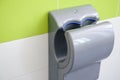 Hand dryer in public WC, closeup Royalty Free Stock Photo