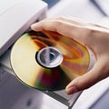 Hand with DVD disk Royalty Free Stock Photo