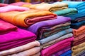 hand-dyed textile fabrics folded in a market stall