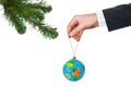 Hand with earth and Christmas tree Royalty Free Stock Photo