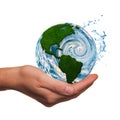 Hand with Earth symbol made by grass and water Royalty Free Stock Photo