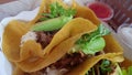 Hand eating corn tortilla carnitas taco Mexican poppular food 4k