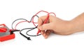 Hand and electric multimeter Royalty Free Stock Photo