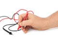 Hand and electric multimeter Royalty Free Stock Photo