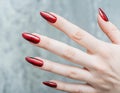 hand of elegant young woman nail polish red long square nails, generated Ai image