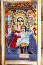 Hand embroidered icon of the Mother of God by unknown craftsman - sample of Russian folk art in a small rural church