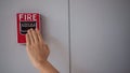 Hand with Emergency Fire alarm notifier or alert or bell warning equipment use when on fire Royalty Free Stock Photo