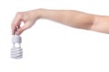 Hand with energy saving lamp on white background Royalty Free Stock Photo