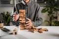 Hand of engineer man protection blocks wood tower