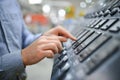 Hand of engineer turn power button on panel control machine Royalty Free Stock Photo