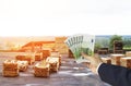 Hand with euro money in the background of a warehouse with finished boards, wood, planking