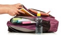 Hand with exercise book and bag Royalty Free Stock Photo