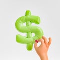 hand exploding a dollar balloon Royalty Free Stock Photo