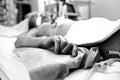 Hand extremely exhausted patients dying in a hospital bed. Black Royalty Free Stock Photo