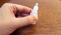 Hand with eye drop bottle Royalty Free Stock Photo