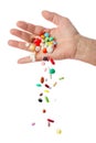 Hand and falling pills Royalty Free Stock Photo