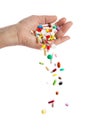 Hand and falling pills Royalty Free Stock Photo