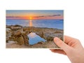 Hand and Famous stone Sin Bridge at sunrise in Ayia Napa Cyprus my photo Royalty Free Stock Photo