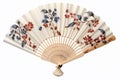 hand fan with traditional asian motifs on a bamboo mat