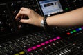 Hand of female audio engineer using sound mixer Royalty Free Stock Photo