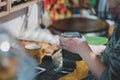 Hand of female chef grating cheddar cheese on metal grater Royalty Free Stock Photo