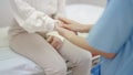 Hand of female doctor comforting patient at consulting room Royalty Free Stock Photo